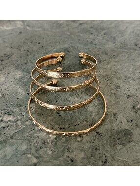 Set of Four Gold Costume Bracelets Bangles
